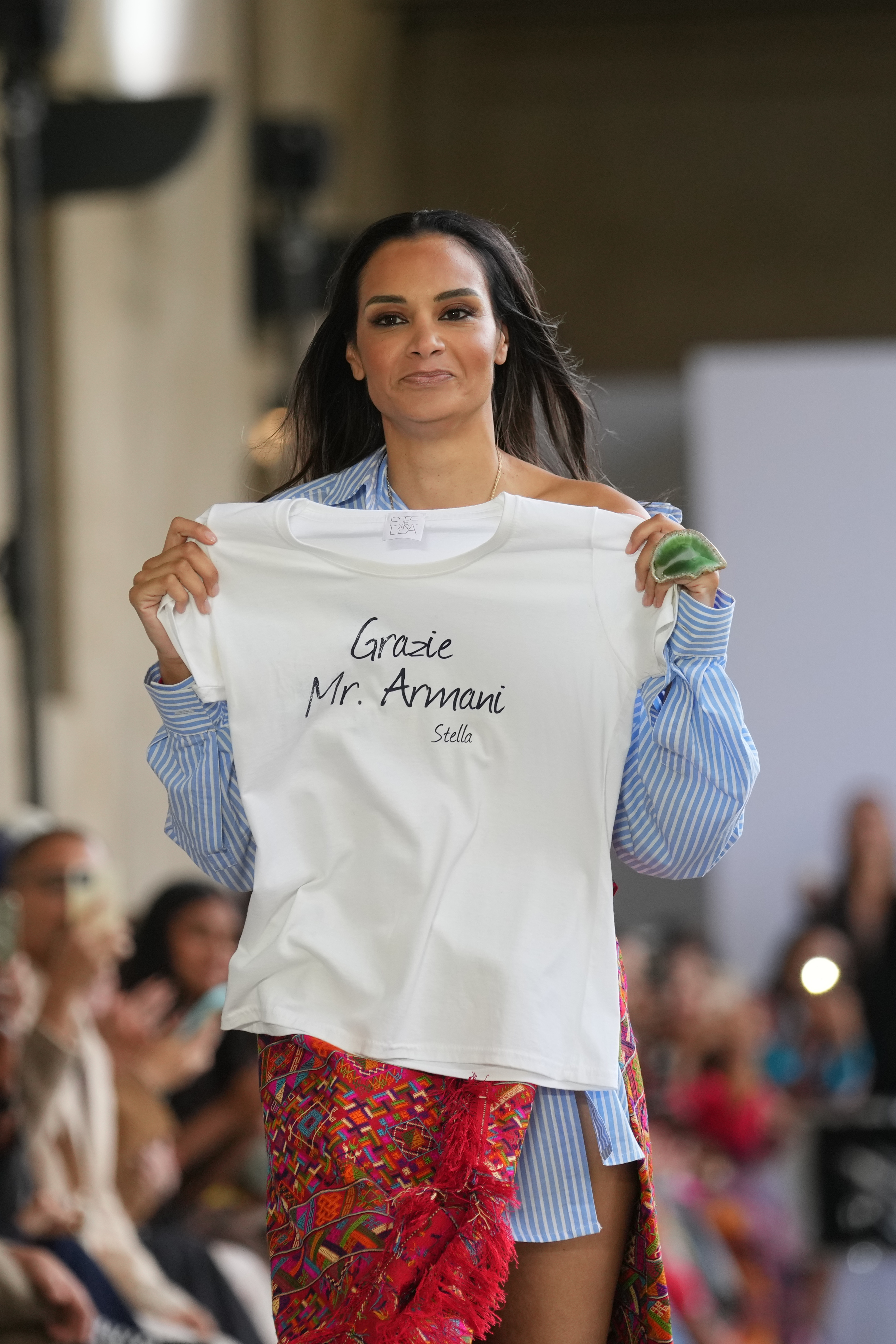 Fashion designer Stella Jean walks the runway with a tribute to late Italian fashion legend Giorgio Armani who died in Milan on Sept. 4, at the end of her SpringSummer 2026 collection during Milan Fashion Week in Milan (AP)